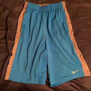 Blue Nike shorts, large